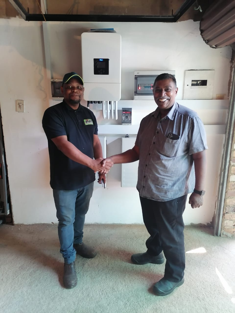 DSD Power Solutions technician with a customer after a completed inverter installation