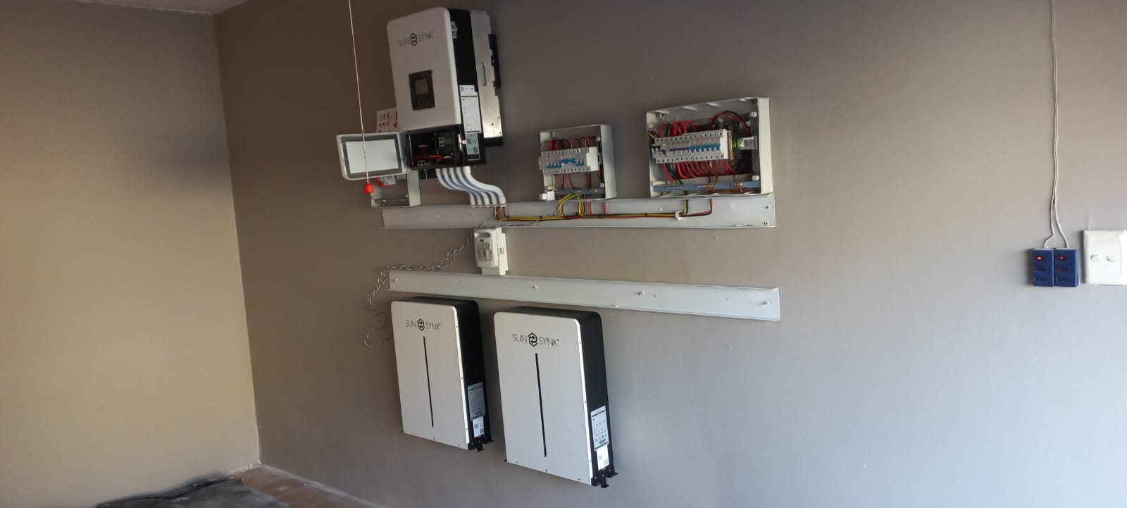 Sunsynk inverter and battery installation in progress with neat trunking